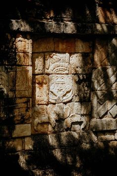 a stone wall with carvings on it