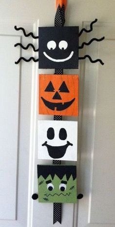 a door hanger decorated with halloween decorations