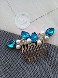 Stylish aquamarine hair comb that works great with bridesmaids or bridesmaids hairstyle. Small and concise. Sparkling and delicate. The width of the hair comb is about 5 inches. The aquamarine hair comb is made of crystal rhinestones, pearl beads and jewelry wire. Great gift for bridesmaids! Hair combs are packaged in individual gift boxes. ANY combination of crystal rhinestones and beads! * All orders from the Exclusive Wedding Shop you will receive in a FREE beautiful gift box. * Standard ship Aquamarine Hair, Teal Wedding Theme, Bridesmaids Hairstyle, Headpiece Wedding Hair, Wedding Bridal Hair, Wedding Hair Head Piece, Bridesmaids Hair, Teal Hair, Turquoise Hair