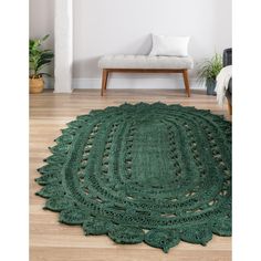 a green rug on the floor in a living room