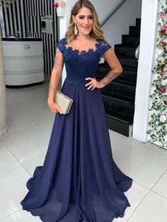 Mother of the Bride Dress Navy Blue Chiffon Long Scoop A-Line 2025 is made-to-order by professional tailors. You can choose from 40+ colors and sizes 2 to 16W. This chic dress is also perfect as your wedding guest dress. Product Details: Silhouette: A-Line/Princess ;Season: Spring , Summer , Fall , Winter ;Fabric: Chiffon ;Neckline: Scoop ;Waist: Natural ;Sleeve: Sleeveless ;Embellishment: Lace ;Back Model: Other ;Hem/Train: Sweep/Brush Train ;Shown Color: Navy Blue Evening Dresses Long Elegant Navy Blue, Navy Blue Prom Dresses, Mother Wedding Dress, Bride Groom Dress, Winter Fabric, Mothers Dresses, Wedding Dress Shopping, Evening Gowns Formal, Prom Dresses Blue