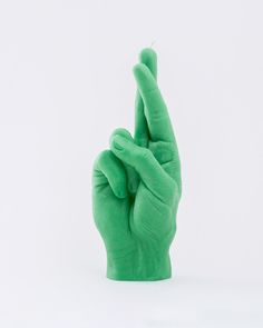 a green hand making the v sign with it's index and fingers in the air