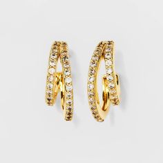 Add some attitude to even the simplest of your outfits with these 14k Gold-Plated Cubic Zirconia Faux-Duo Pave Hoop Earrings from A New Day™. The open-hoop earrings feature two lopsided rows paved with clear crystals that are linked at the ends with a front-facing cutout to form an absolutely stunning design. Set on post hardware with butterfly backs for secure wear, these crystal hoops are made of 14K gold-plated, nickel-free metal in a gold finish. Best of all, these earrings come elegantly pa Pave Hoop Earrings, Gold Hoops Earrings, Cubic Zirconia Hoop Earrings, Open Hoop Earrings, Jewelry Essentials, Clear Crystals, Silver Accessories, Gold Accessories, Girly Jewelry