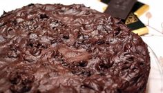 a chocolate cake sitting on top of a white plate