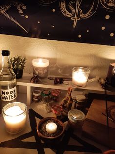 candles, bottles and other items on a shelf