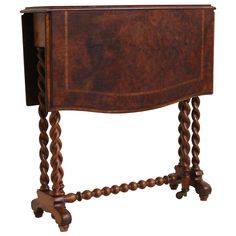 an old wooden table with two legs and a drawer