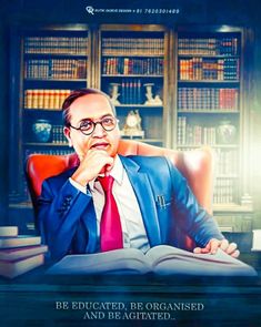 a man in a suit and tie sitting at a desk with an open book on it