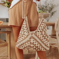 Hit The Beach With Our Cabana Tan/Ivory Hobo Tote! This Two Tone Woven Hobo Tote Bag Features A Faux Leather Strap And Comes In A Crochet Woven Straw Design. Paper/Polyester Blend. Zipper Closure. 1 Inside Open Pocket. 1 Inside Zipper Pocket. White Beach Hobo Bag With Adjustable Strap, Beige Beachy Shoulder Bag, White Hobo Bag With Braided Handles For The Beach, Beige Vacation Bag With Braided Handles, Beige Bag With Braided Handles For Vacation, Cream Beachy Bag For Summer, Cream Beachy Bags For Summer, Chic Beige Hobo Bag For Beach, Cream Bag For Summer Vacation