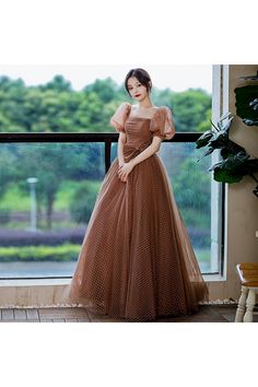 Shop square neck bubble sleeve brown dotted tulle prom dress with bow online. Sheprom offers formal or casual style dresses to fit your special occasions. Square Neckline Prom Dress, Net Gown Designs, Prom Dress With Bow, Brown Gown, Flowy Prom Dresses, Brown Dresses Formal, Fairy Gown, Full Gown, Net Gowns