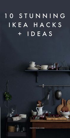 a kitchen with black walls and shelves filled with pots, pans and utensils