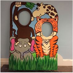 an image of a wooden frame with cartoon animals and giraffes on it