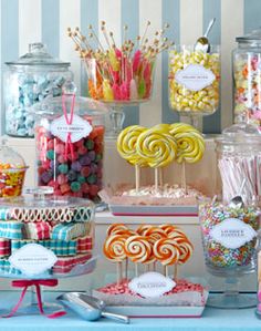 a table topped with lots of candy and lollipops