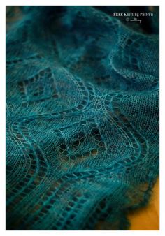 a close up view of a blue shawl