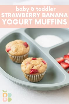 two strawberry banana yogurt muffins are on a plate with strawberries