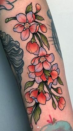 an arm with flowers on it and a bird flying in the sky behind it,