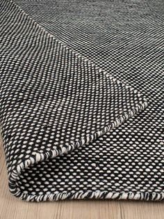 black and white checkered fabric on the floor