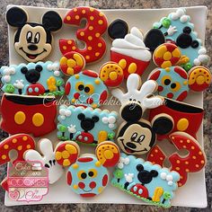 mickey mouse cookies are arranged on a plate