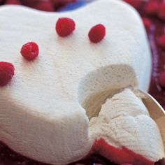 a tooth shaped cake sitting on top of a table