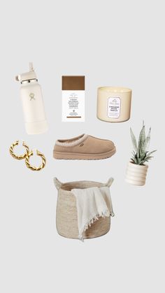 an assortment of items that include shoes, candle, potted plant and other items