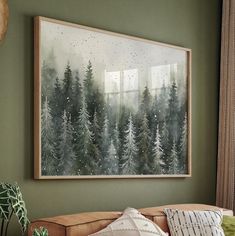 a painting hanging on the wall above a couch in a living room with green walls