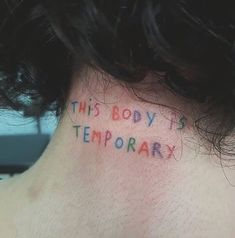 the back of a man's neck with writing on it that says, this body is temporary