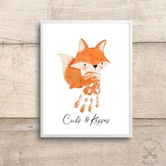 a card with an image of a fox and the words cub & kisses on it