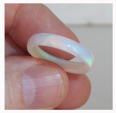 The best gift for a bride is a white wedding ring ! Very beautiful ring made of solid synthetic opal. Unique unrepeatable handmade. Incredibly beautiful and varied overflow of colors depends on the lighting. The photo does not convey the play of colors. Ring to order, for you any size. Width about 4 - 4,5 mm ( depending on size ) Solid Opal Ring, Unique Opal Ring, Gift For A Bride, Opal Band Ring, White Wedding Ring, Opal Wedding Band, Unique Opal, Black Opal Ring, Opal Wedding