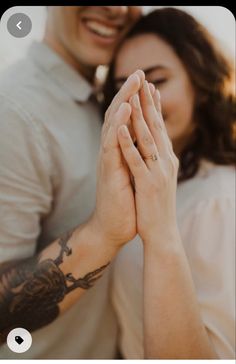 a man and woman are holding hands together