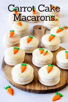 carrot cake macarons on a wooden platter with the words carrot cake macaroons