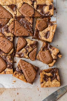 chocolate chip cookie bars cut into squares on parchment paper