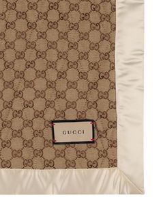 a gucci scarf with a tag on it