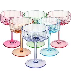 PRICES MAY VARY. Introducing the Bright Colored Flower Coupes, a set of six exquisite glassware pieces that combine elegance with a unique touch of color. Standing at 5.1 inches tall with a diameter of 3.9 inches, these coupes offer a capacity of 7 ounces, allowing you to enjoy your favorite martinis or cocktails in style. The standout feature of these glasses is their stunning bright colors and intrique design. Each glass is beautifully crafted and colored in pink, magenta blue, green, and oran Colorful Glassware Bar, Flower Shape Glasses, Prosecco Mimosa, Colorful Cocktails, Cocktail Glassware, Champagne Cocktail, Vintage Champagne, Flower Vintage, Cocktail Glasses