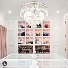 the closet is filled with shoes and handbags