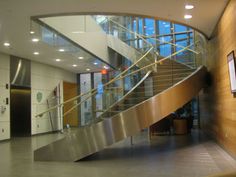 a metal stair case in an office building