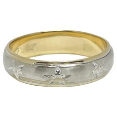 two tone gold and silver wedding band with flowers