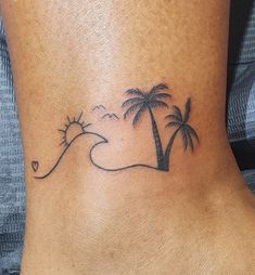 a small palm tree tattoo on the ankle