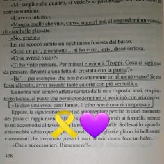 an open book with a yellow and purple heart on the page next to each other