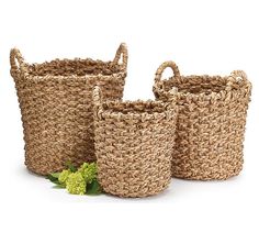 three woven baskets with handles and handles