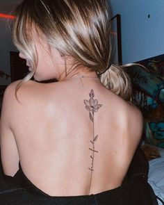 a woman with a tattoo on her back