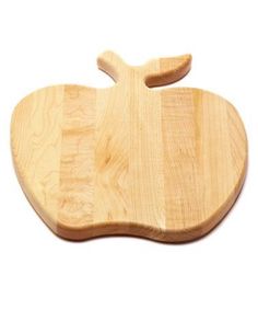 an apple shaped wooden cutting board on a white background