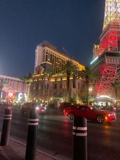 the eiffel tower is lit up at night in las vegas, nv