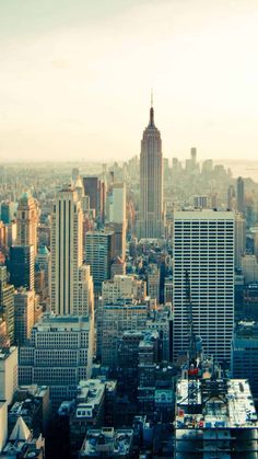 an aerial view of new york city with skyscrapers