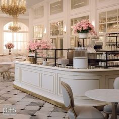 the interior of a restaurant with tables, chairs and chandeliers hanging from the ceiling