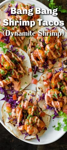 three shrimp tacos on a plate with cole slaw