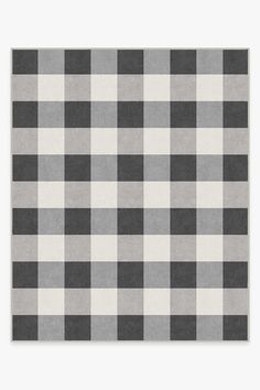 a black and white checkered rug with grey border