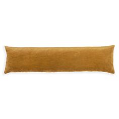 an orange velvet pillow on a white background