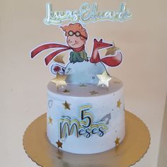 a birthday cake with an image of a boy on top and stars around the edges