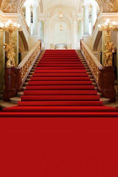 red carpeted stairs leading up to an ornate building