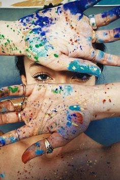 two hands with paint all over them and the words, i am biamless