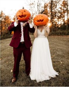 a bride and groom holding pumpkins up to their faces in front of the camera